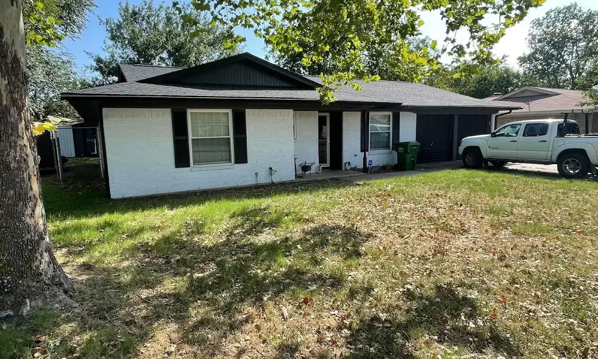 Professional roofing crew working on a residential roof in Gibsonville